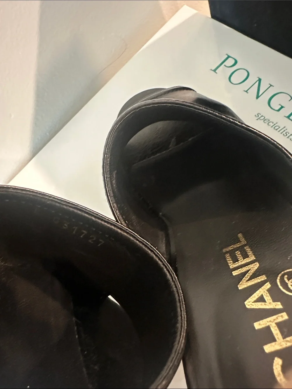 CHANEL Black Leather Camellia-Embellished Mules